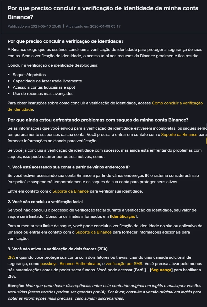 Página da central de ajuda da Binance em português, atualizada em 2026-04-08, explicando que a verificação de identidade desbloqueia saques e depósitos, trade livre e acesso a contas fiduciárias e spot, e listando três motivos de problemas com saques, incluindo a falta de autenticação de dois fatores